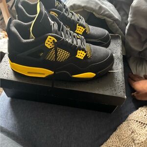 Air Jordan 4s Black and Yellow Sneakers